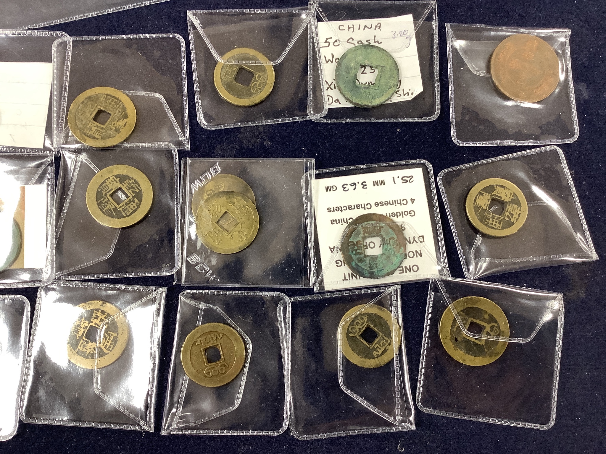 A collection of Chinese coins, stamps and two Japanese banknotes